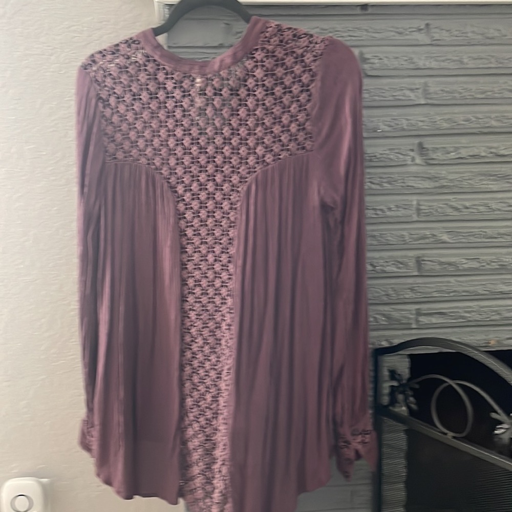 Free People size small rose shade of purple detailed blouse. Flows nicely.
